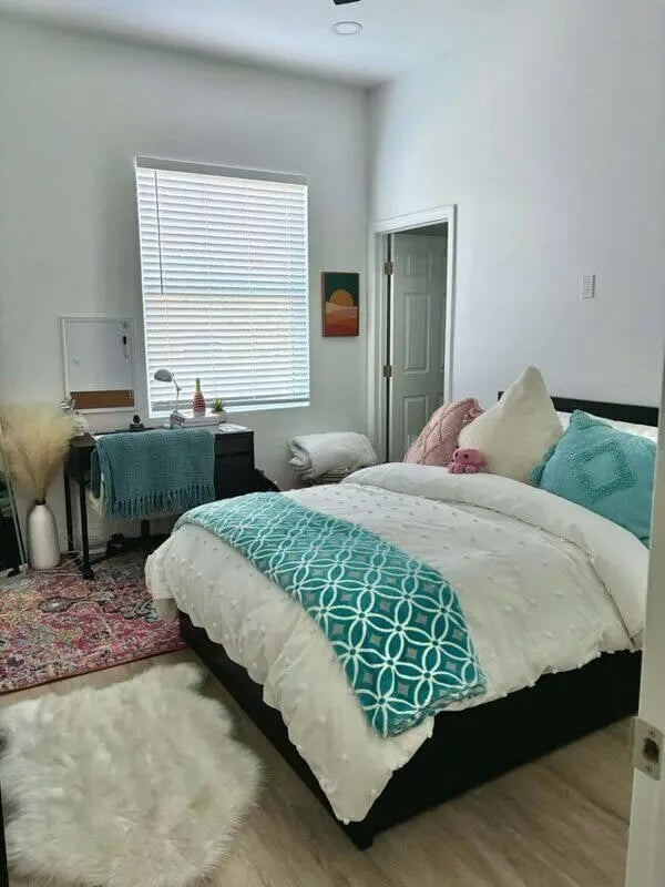 Bed desk rug and fluffy mat bedroom at CigarLofts in Tampa Student Accommodation