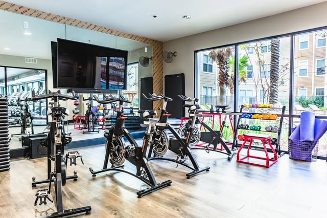 Spin bikes dumbbells and yoga mats gym at Saga Tallahassee in Tallahassee Student Accommodation