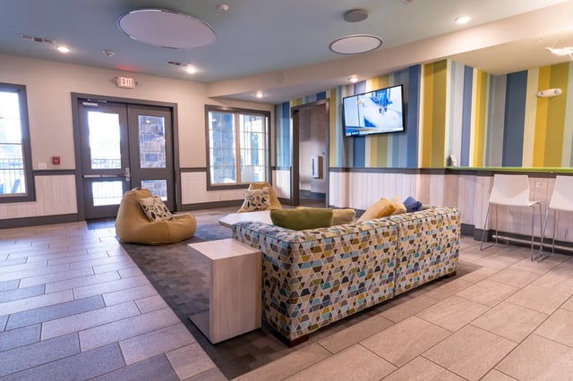 Sofa beanbags and TV in common area living room at The Retreat at Tampa in Tampa Student Accommodation