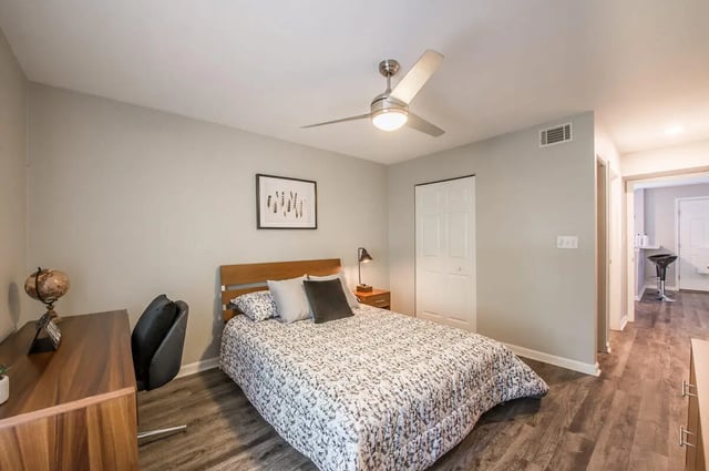 Bed desk fan artwork and closet bedroom at Elevate on Cascade in Tallahassee Student Accommodation