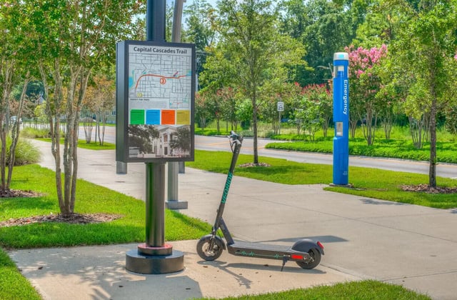 Information sign and scooter exterior at Elevate on Cascade in Tallahassee Student Accommodation