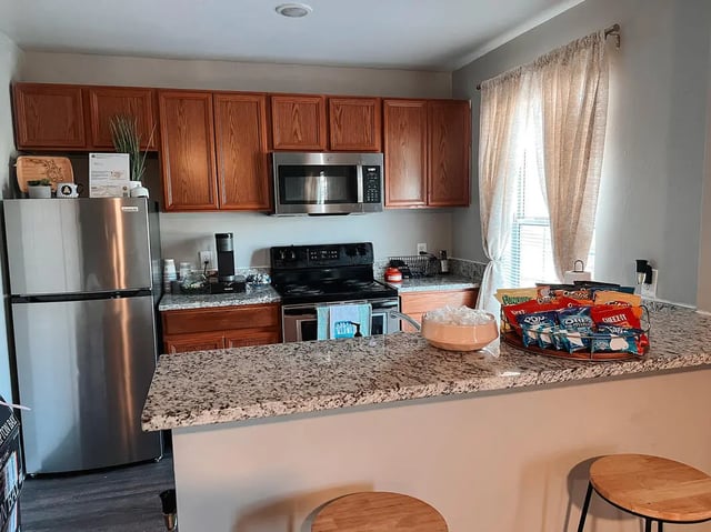 Stainless steel refrigerator microwave oven snacks kitchen. at Elevate on Cascade in Tallahassee Student Accommodation