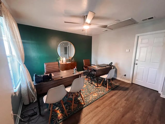 Two desks chairs rug mirror study area at Elevate on Cascade in Tallahassee Student Accommodation