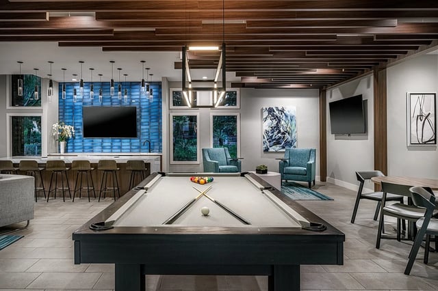 Pool table chairs and bar stools living room at Oxford Manor in Gainesville Student Accommodation