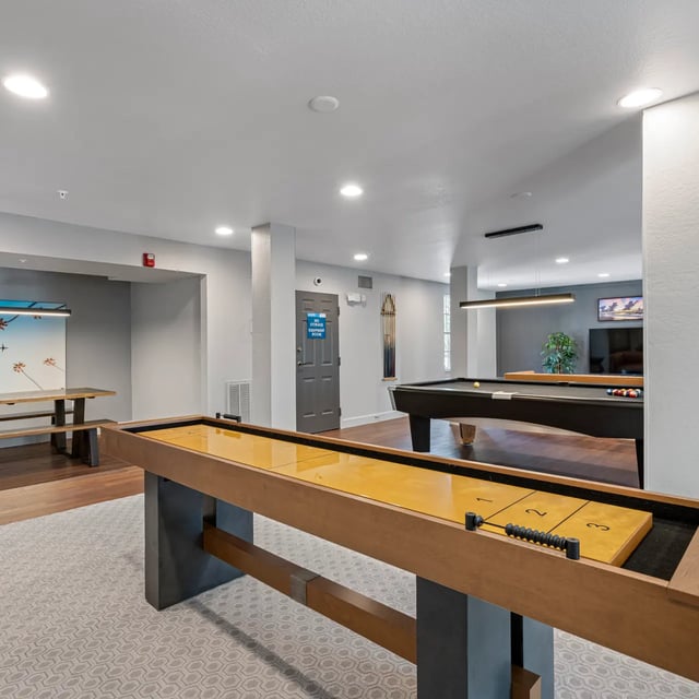 Shuffleboard and pool table common area recreation room at VUE Tampa in Tampa Student Accommodation