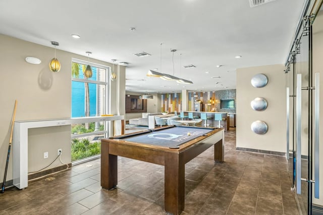 Pool table bar area lounge and living room at IQ Apartments in Tampa Student Accommodation