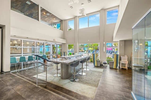 Bar with stools and seating area common area at IQ Apartments in Tampa Student Accommodation