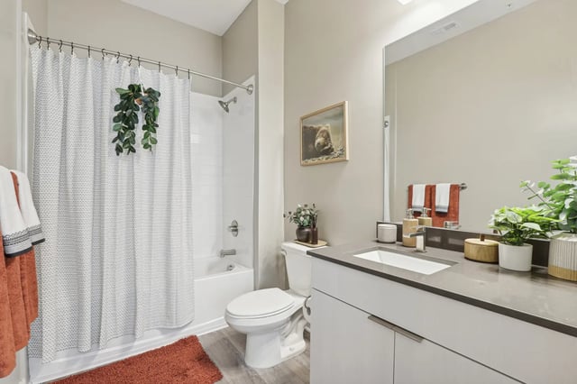 Bathroom with shower bathtub toilet and vanity. at The Metropolitan Tampa in Tampa Student Accommodation