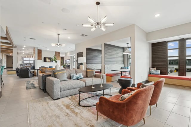 Modern lounge area with sofas and armchairs living room at The Metropolitan Tampa in Tampa Student Accommodation