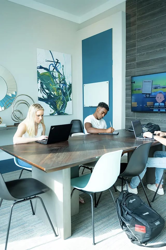 Students working laptops whiteboard and TV Study Area at The Metropolitan Tampa in Tampa Student Accommodation