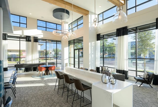 Bar seating shuffleboard table dining area living room at The Metropolitan Tampa in Tampa Student Accommodation