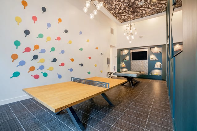 Ping pong table pool table and colorful wall decorations Recreation area at The Accolade Collegiate Village East in Orlando Student Accommodation