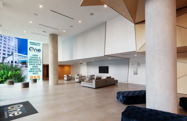 Lobby with seating and signage common area at The One at University City in Miami Student Accommodation