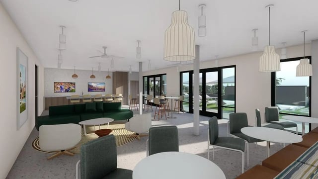 Green sofa bar stools and seating area Living room at The Row UF in Gainesville Student Accommodation