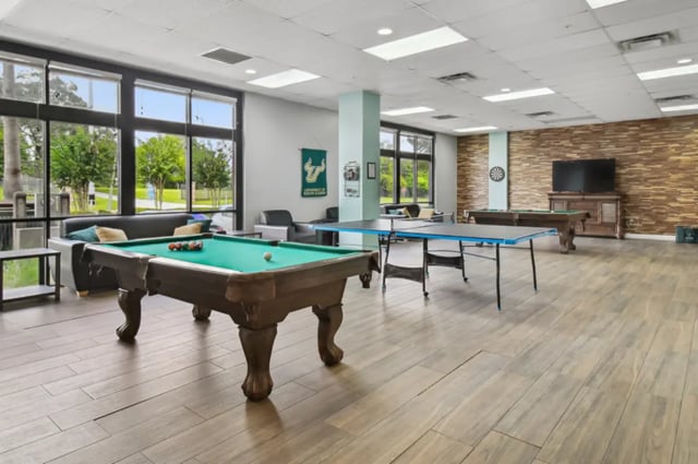 Pool table ping pong table living room at Malibu Apartments in Tampa Student Accommodation