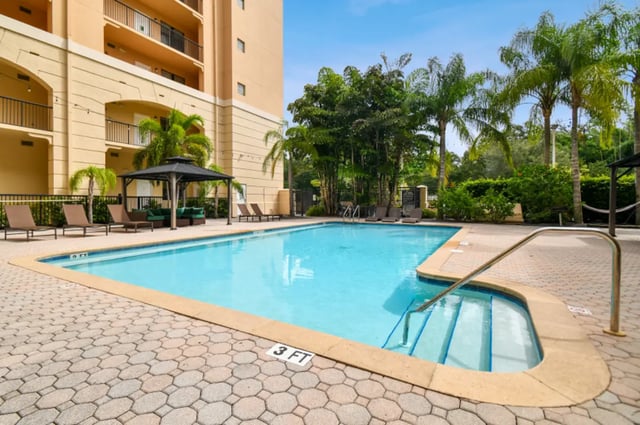 Pool with loungers and gazebo exterior at Malibu Apartments in Tampa Student Accommodation