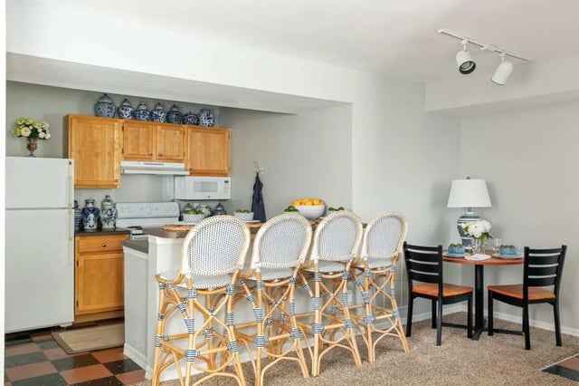 Barstools dining set and cabinets kitchen at The Social Tampa in Lutz Student Accommodation
