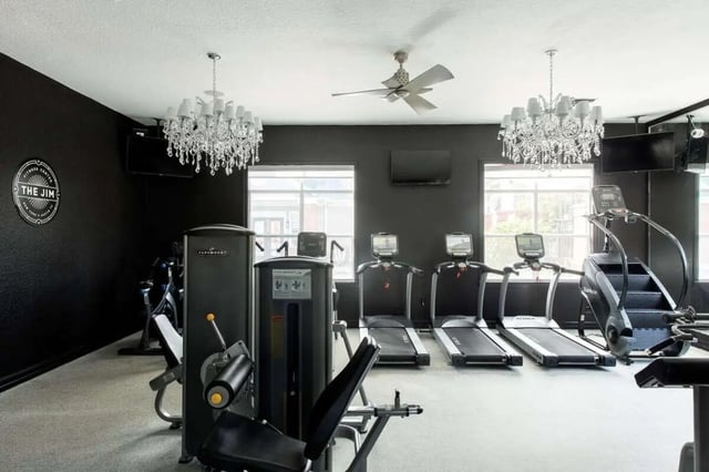 Gym equipment including treadmills and weight machines Fitness area at The Social Tampa in Lutz Student Accommodation
