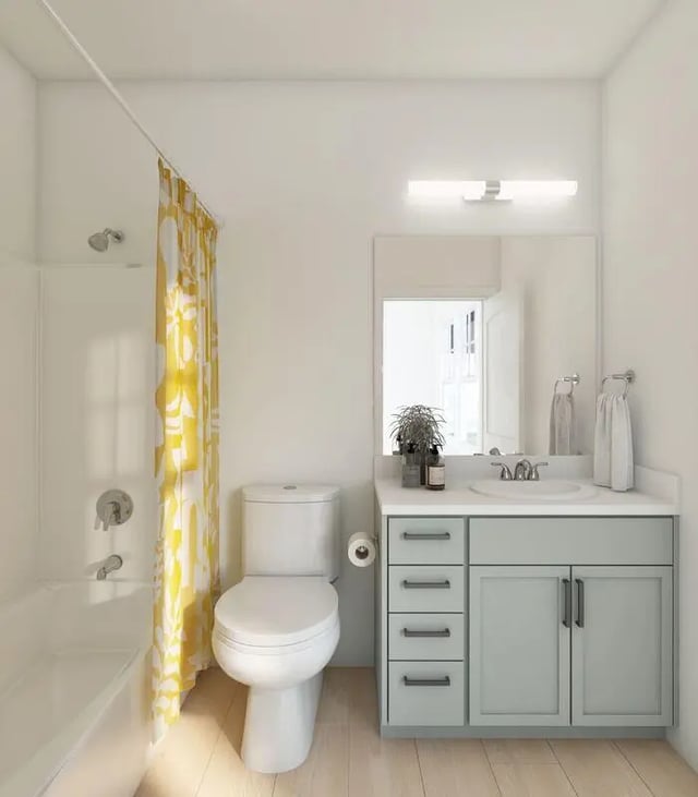 Tub toilet vanity mirror and plant bathroom at Aspen Tampa in Tampa Student Accommodation