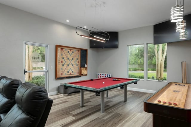 Pool table Scrabble board shuffleboard playing area at The Enclave in Gainesville Student Accommodation