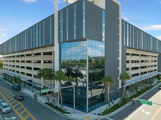 Modern grey building glass corner and parking garage exterior at VOX Miami in Miami Student Accommodation