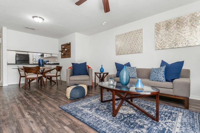 Sofa chairs coffee table dining set living room at Greenwich Green Aspen Ridge in Gainesville Student Accommodation
