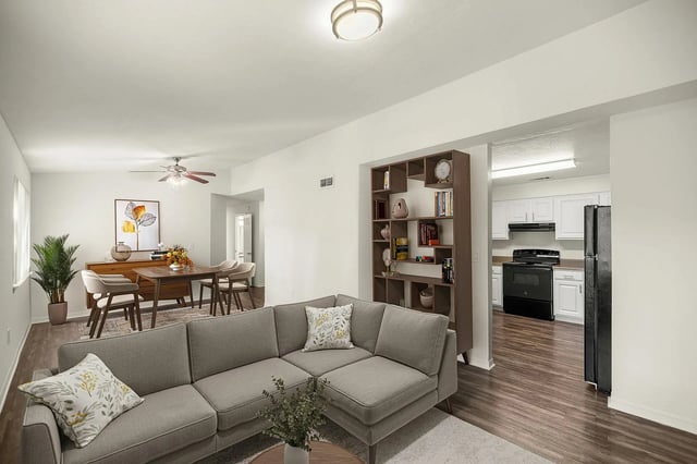 Grey sectional sofa dining area and kitchen living room at Greenwich Green Aspen Ridge in Gainesville Student Accommodation