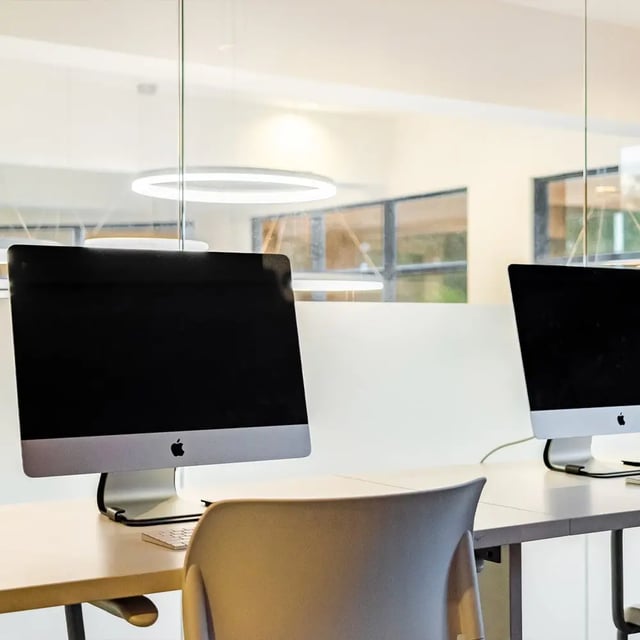 Two Apple iMacs at desks study area at Halo 46 in Tampa Student Accommodation