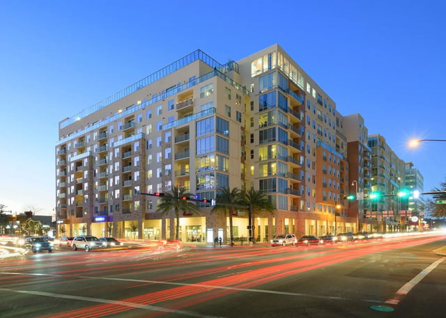 Modern apartment building with balconies and street lights exterior at The Standard at Gainesville in Gainesville Student Accommodation