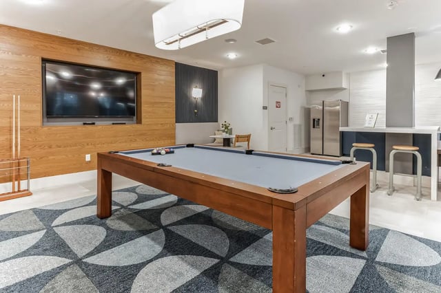 Pool table television and bar area recreation room at RISE 34 in Gainesville Student Accommodation