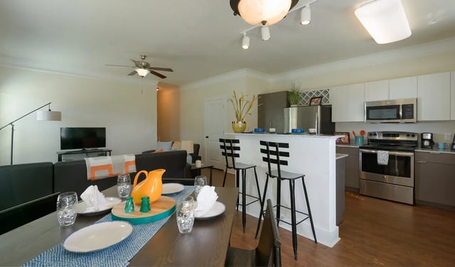 Dining table kitchen counters with bar stools kitchen at The Retreat at Gainesville in Gainesville Student Accommodation