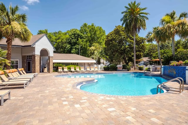 Poolside loungers and pool area exterior at Spyglass Apartments in Gainesville Student Accommodation