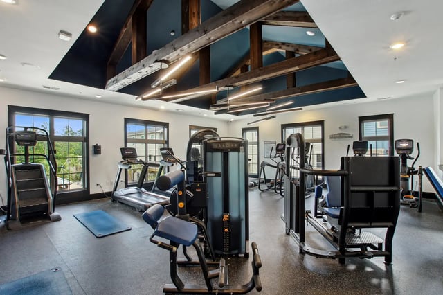 Gym with treadmills weight machines and exercise bikes gym at The Station Alafaya in Orlando Student Accommodation