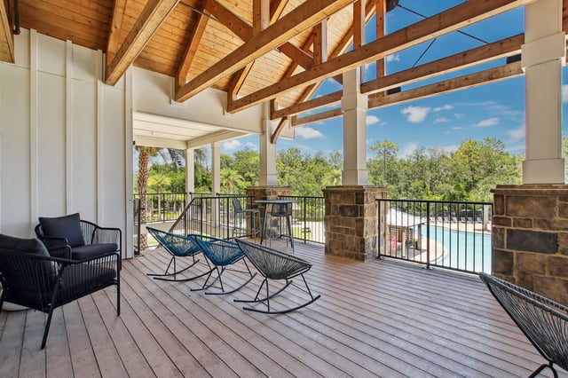 Black chairs rocking chairs table and chairs patio at The Station Alafaya in Orlando Student Accommodation