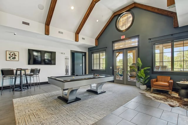 Pool table bar stools television game room at The Station Alafaya in Orlando Student Accommodation
