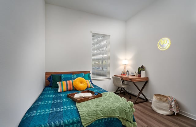 Bed desk neon smiley lamp basket bedroom at The Accolade Collegiate Village West in Orlando Student Accommodation