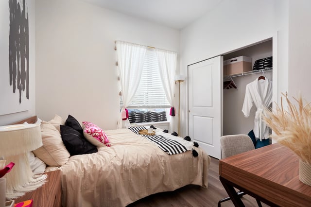 Bed closet white robe and desk bedroom at The Accolade Collegiate Village West in Orlando Student Accommodation