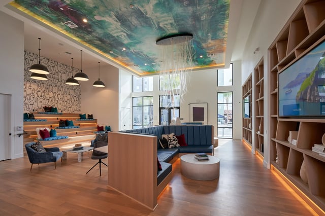 Seating area with mural and large windows lounge at The Accolade Collegiate Village West in Orlando Student Accommodation