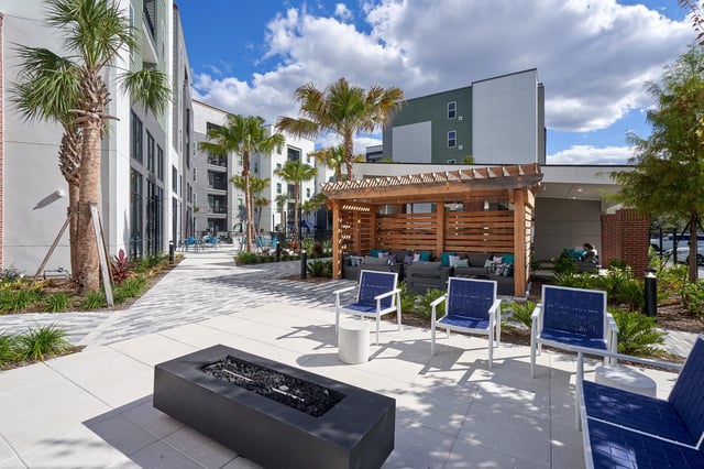 Fire pit lounge chairs outdoor seating area exterior at The Accolade Collegiate Village West in Orlando Student Accommodation