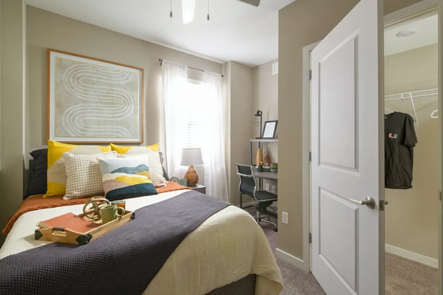 Bed desk and closet student bedroom interior at The Standard at Coral Gables in Miami Student Accommodation