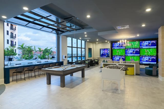 Pool table foosball and large screen tvs common area at The Standard at Coral Gables in Miami Student Accommodation