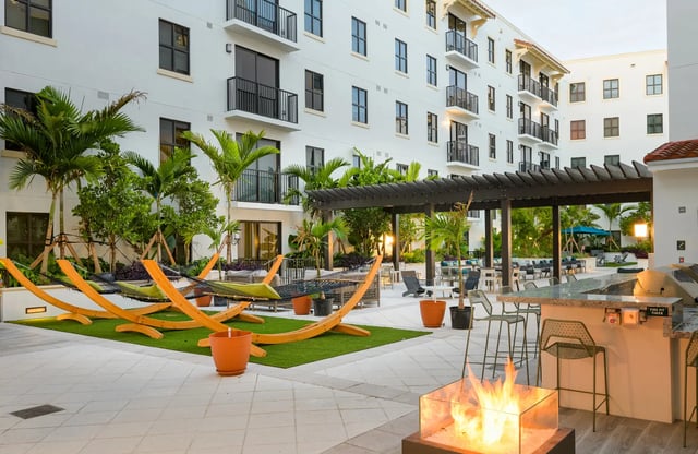 Hammocks fire pit outdoor kitchen patio area exterior at The Standard at Coral Gables in Miami Student Accommodation