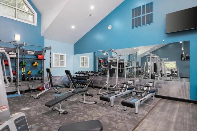 Weight machines rowing machines and benches fitness room at Lexington Crossing in Gainesville Student Accommodation