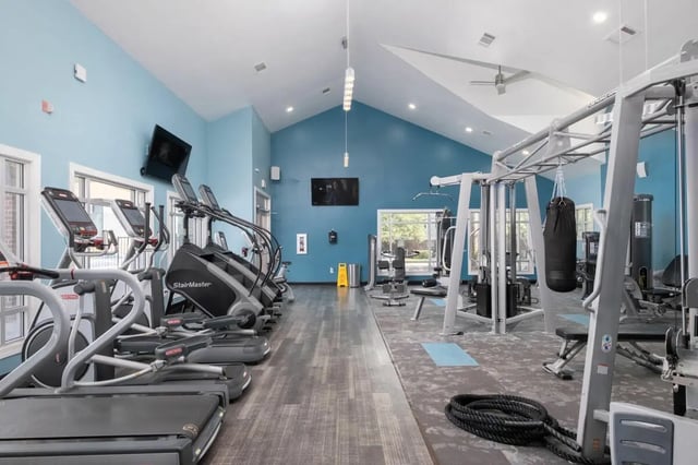 Gym equipment treadmills stair climbers punching bag fitness center at Lexington Crossing in Gainesville Student Accommodation