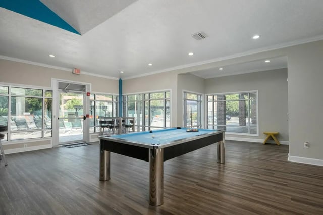 Pool table with balls and cues recreation area at Lexington Crossing in Gainesville Student Accommodation