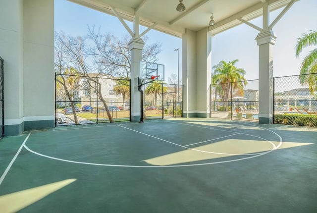 Basketball hoop on covered court playing area exterior at The Lofts Orlando in Orlando Student Accommodation