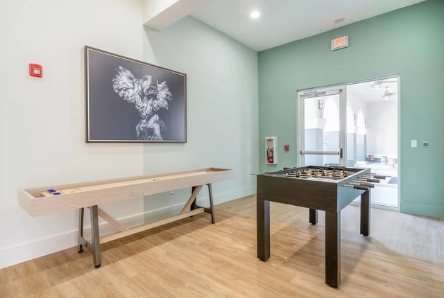 Shuffleboard foosball table artwork recreation area at The Lofts Orlando in Orlando Student Accommodation