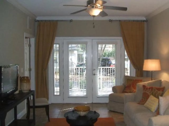 Sofa chair television and French doors living room at Nantucket Walk in Gainesville Student Accommodation