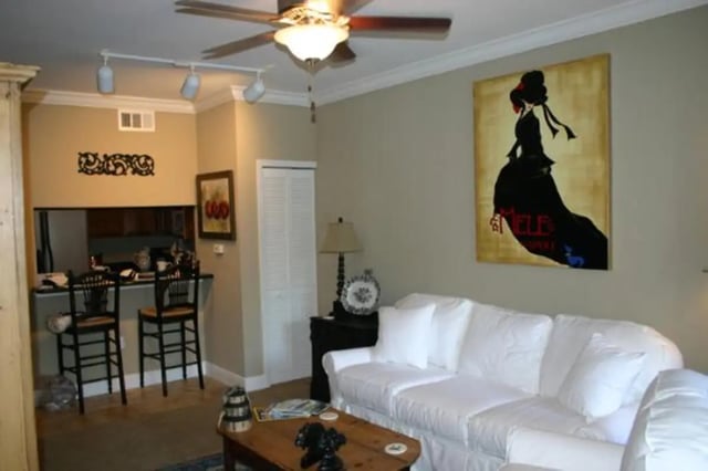 White sofa bar stools art and ceiling fan living room at Nantucket Walk in Gainesville Student Accommodation