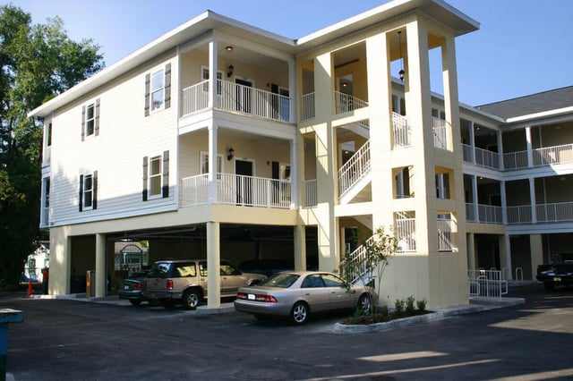 Apartment building with balconies and cars exterior at Nantucket Walk in Gainesville Student Accommodation